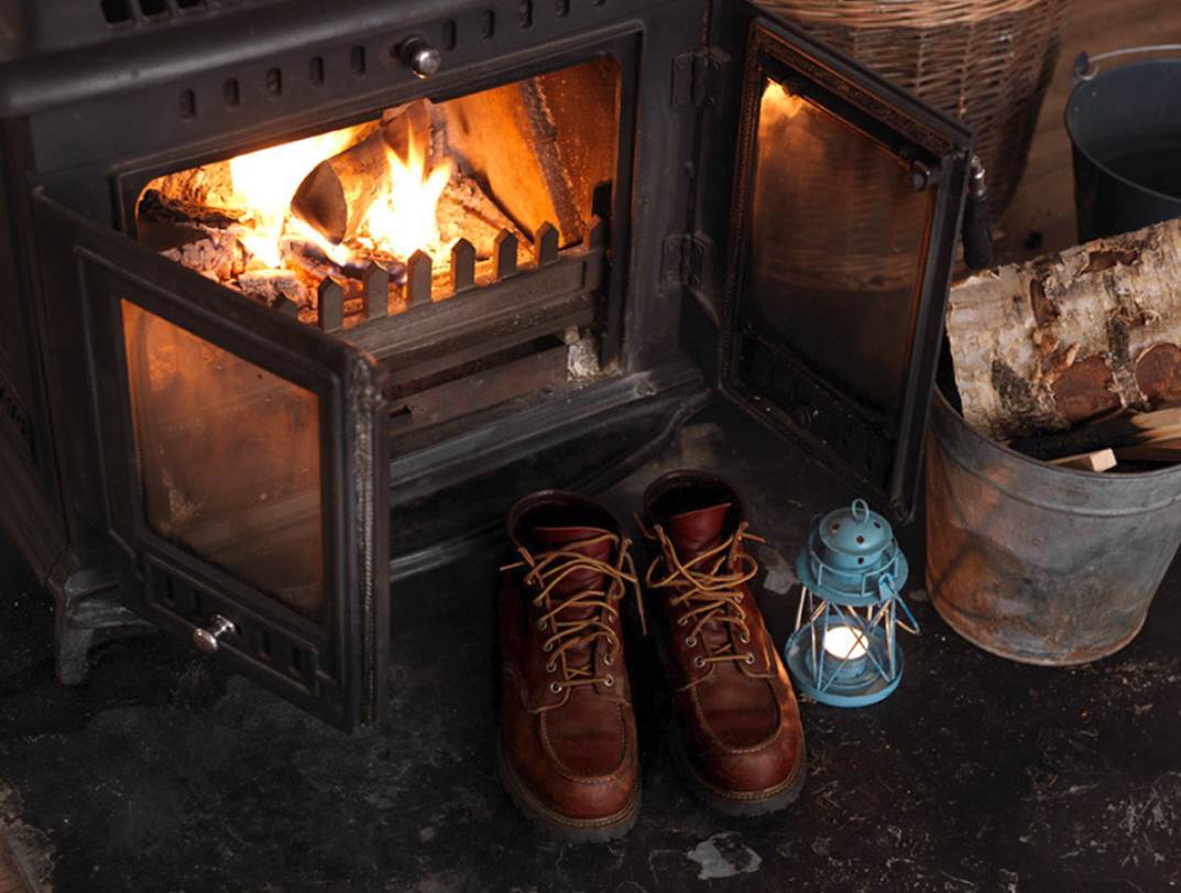 Shoes drying by an open fire